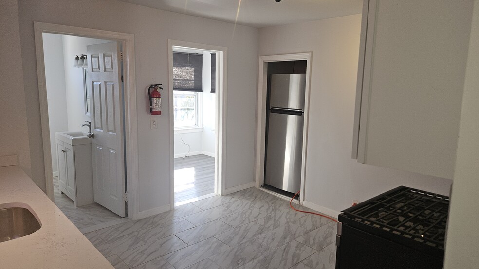 Kitchen showing bathroom and den - 31 Marne St