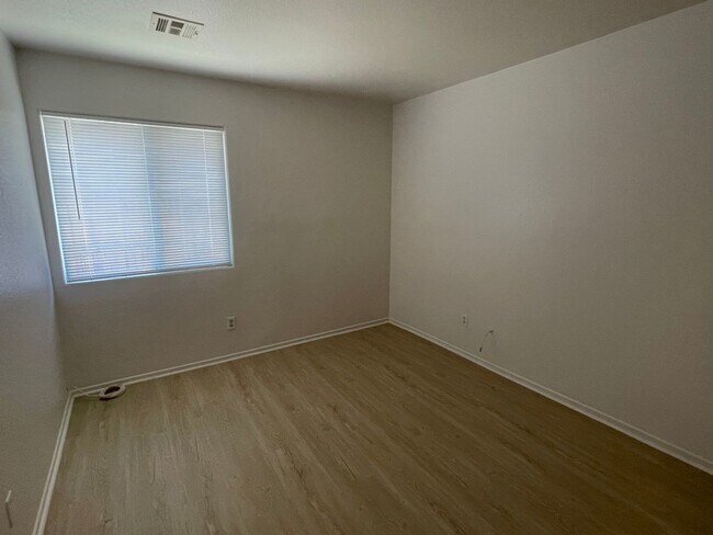 Building Photo - Adelanto Home-3 Bedrooms,2 Bathrooms, Laminate Floors, Indoor Laundry Room, Large Back Yard