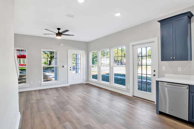 Building Photo - **Available now. This pet-friendly property features a small fenced yard with water and lawn main...