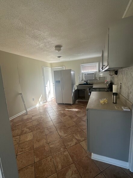 Access to laundry room which houses the washer and dryer - 511 Harris Estate Dr