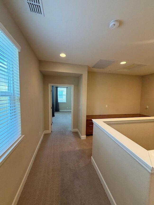 Building Photo - Solar Home with EV Garage Charging. 4 Bedroom Home with Downstairs Bedroom and Full Bathroom.