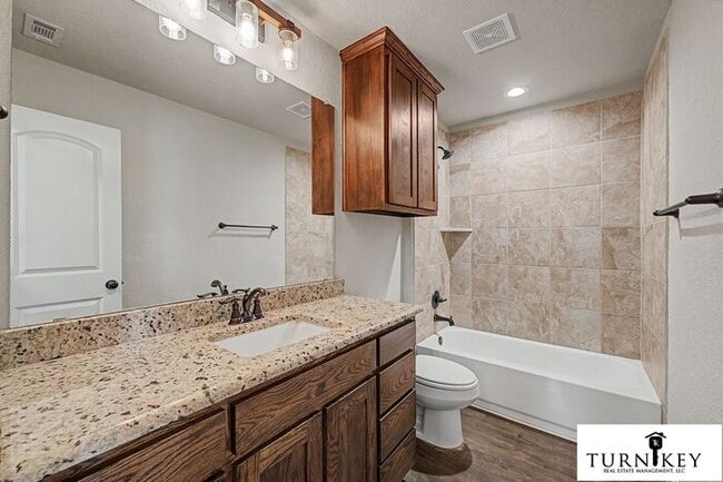 Building Photo - COMING SOON! 3BD/2BA Energy-Efficient Duplex | Granite | Island Kitchen | Garage | Yard Care Incl...