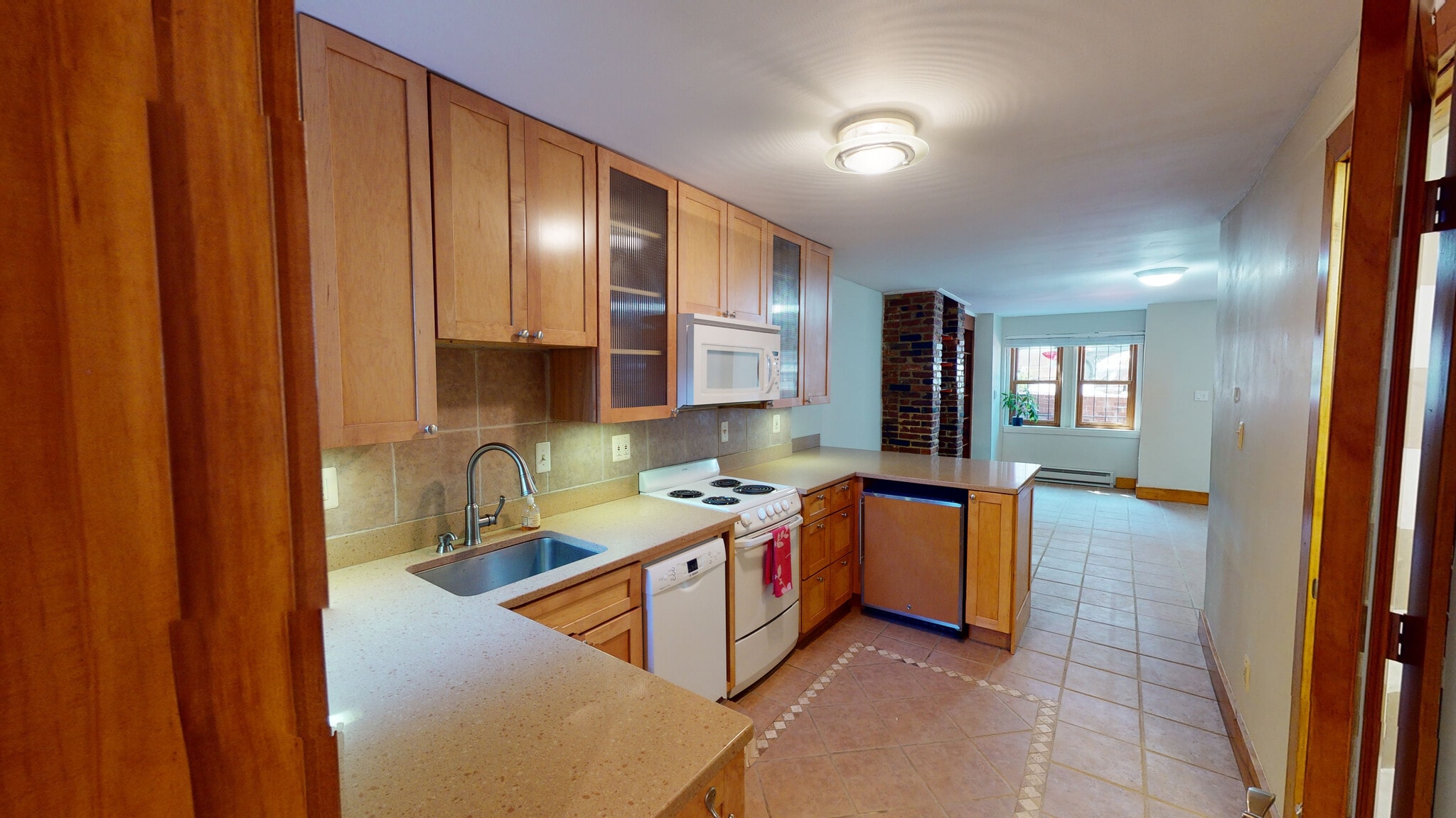 High end undercounter fridge and freezer provide an open airy feel - 608 1/2 Acker Place NE