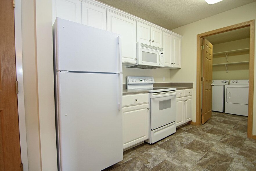 Our kitchens are equipped with modern appliances for everyday convenience. - Pinebrook Apartments