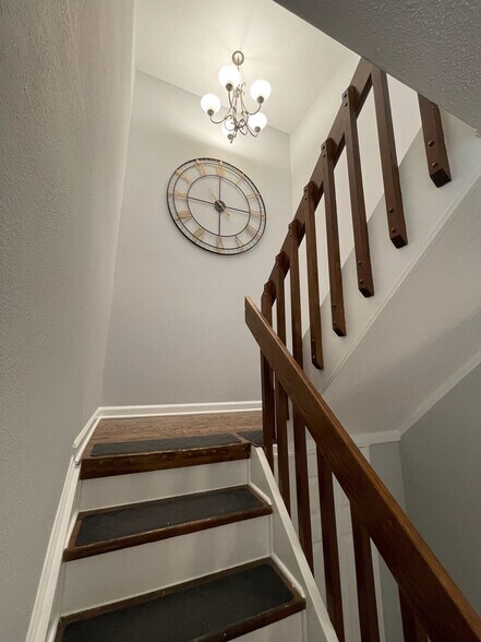 Stairway with chandelier and landing (looking up) - 4204 Whistler Ct
