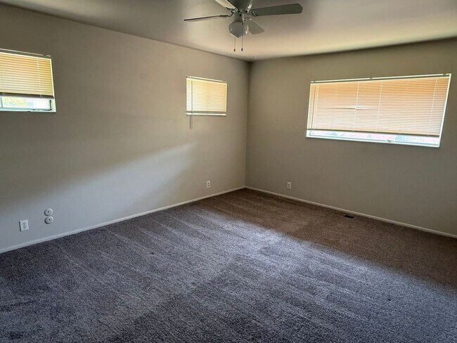 Building Photo - Beautiful town home with deep 2 car garage and a large covered patio