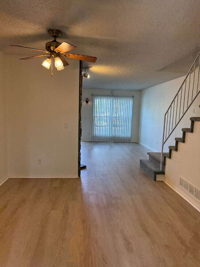 Building Photo - Cozy 2 Bed, 1.5 Bath Townhouse with Fireplace + Community Pool + Reserved Parking Space!