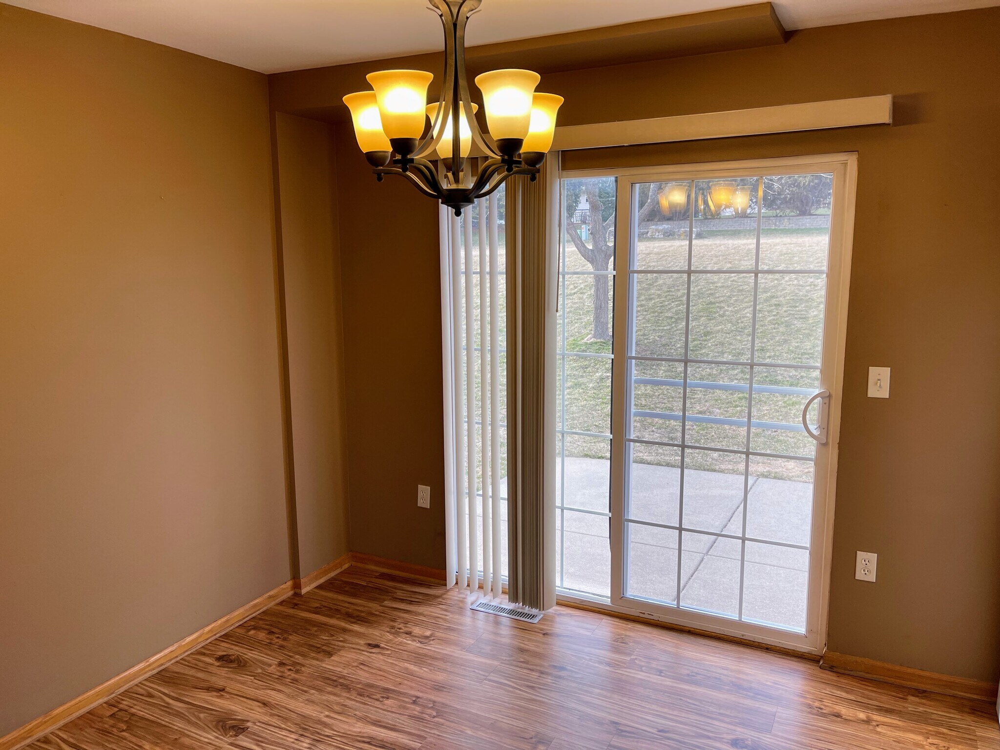 Dining area with a screen door looking out towards the large backyard - 2216 Patrick Ln