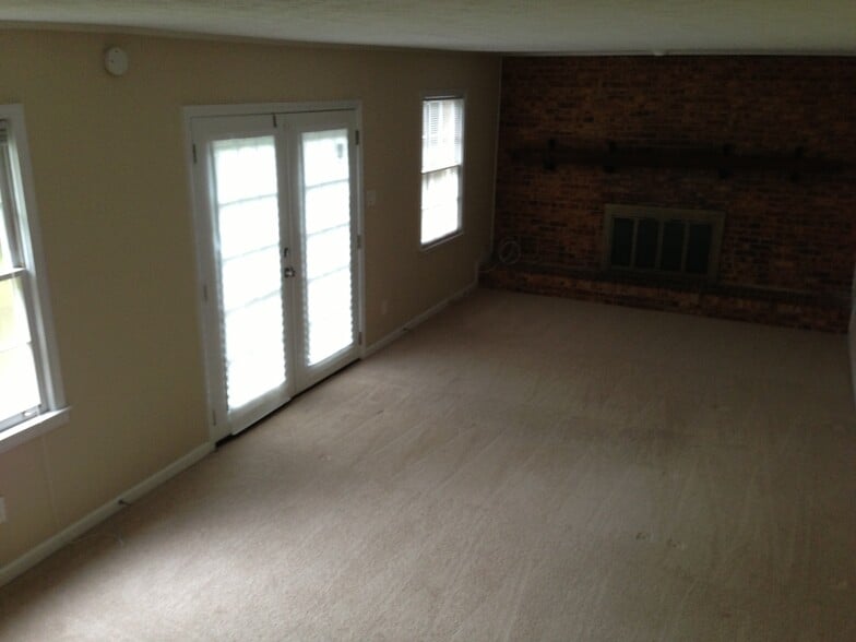 Den with French doors leading to patio and back yard - 518 Barbashela Cir