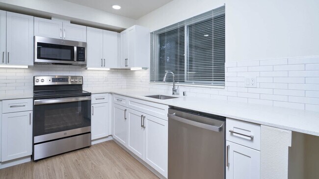 Kitchen with Stainless Steel Appliances - Ivorywood