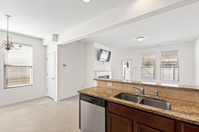 Building Photo - Spacious 4-Bedroom End-Unit Townhome in a ...