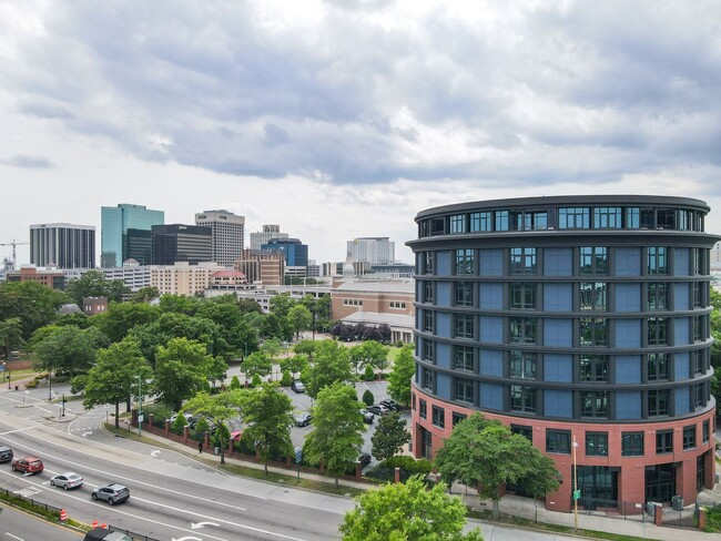 Building Photo - Industrial-Themed Mid-Rise, One-Level Cond...