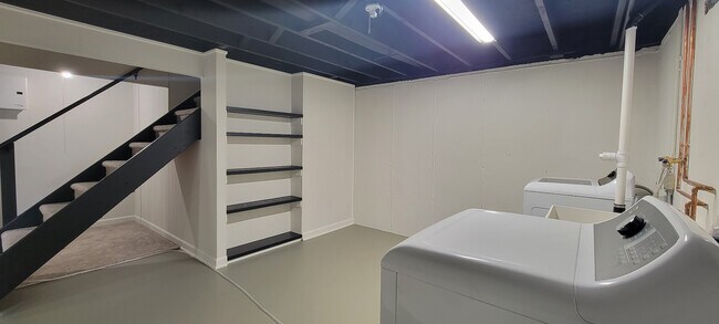 Freshly painted laundry room with brand new washer and dryer, new copper piping, new laundry tub & n - 6305 49th Ave