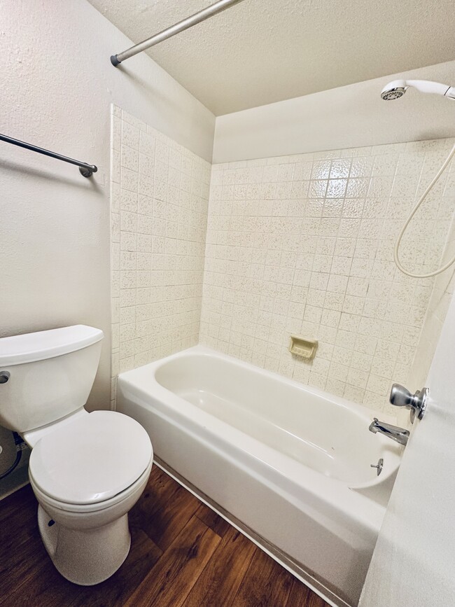 Experience relaxation in this stylish bathroom, featuring modern fixtures and elegant design. - Hawk Point Apartments