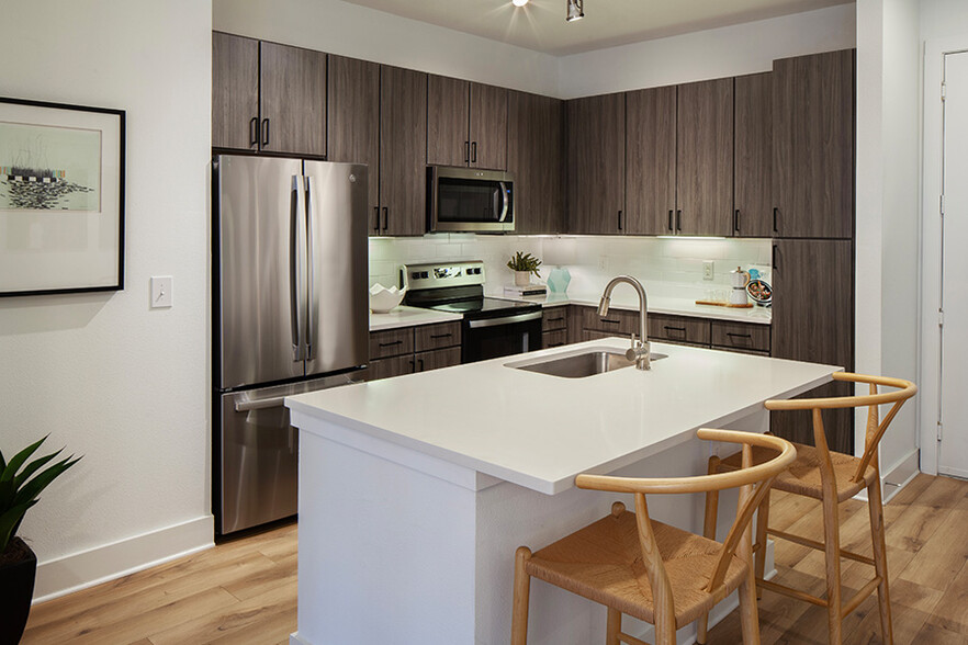 Upgraded kitchens with quartz countertops - 2125 Yale Apartments