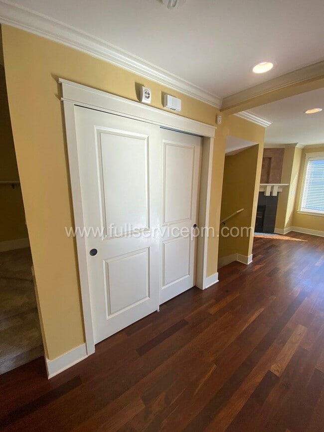 Building Photo - Spacious townhome with private backyard, garage parking, multiple decks, and a dedicated home off...