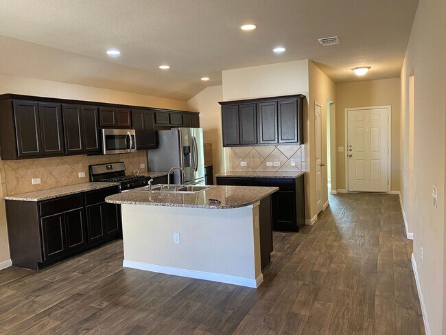 Building Photo - Three Bedroom, Two Bath, Two Car Garage, Washer and Dryer are included.