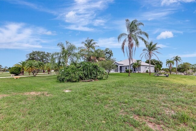 Building Photo - A BOATER'S PARADISE WITH THIS STUNNING 3 BEDROOM, 2 BATH WATERFRONT POOL HOME W/DOCK & BOAT LIFT ...