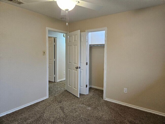 Building Photo - Three bedroom and two bathroom nicely remodeled with new flooring. Large wood fenced backyard