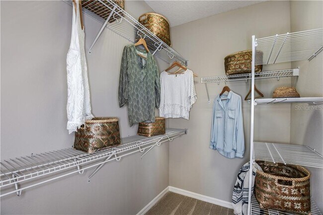 Extra-large walk-in closet very spacious in the master bed room. Lots of space and shelf. Almost lik - 1074 Amber Leaf Trail