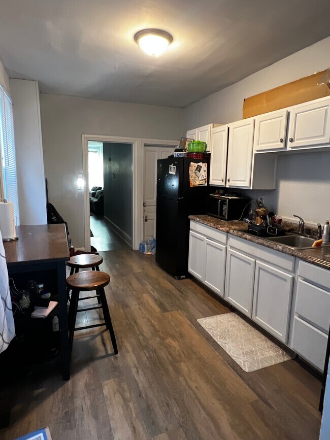 Kitchen from another angle with basement access - 511 W Philadelphia St