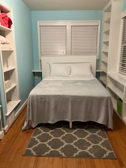 Bedroom with shelves, four large windows - 3741 4th St N