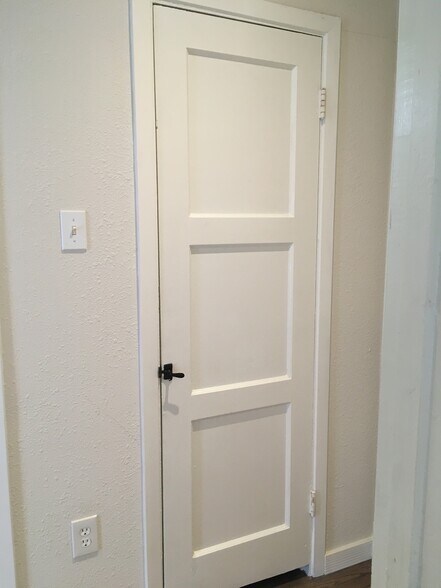Hall closet with vintage door and hardware - 5131 Wildflower Dr
