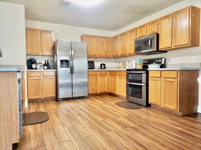Building Photo - Coming Soon Spacious 4-Bedroom Home for Re...