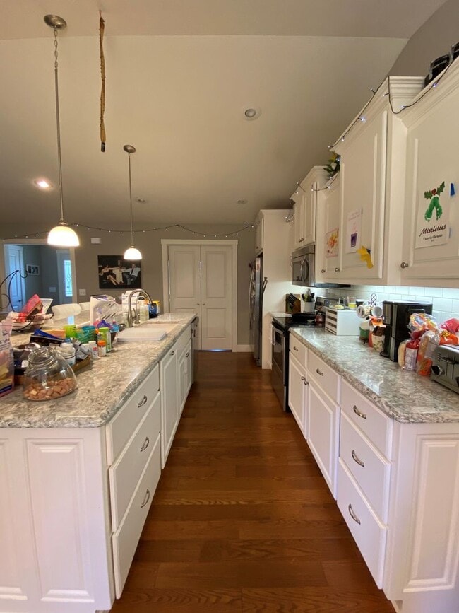 Building Photo - FENCED BACKYARD! BONUS ROOM/OFFICE! SAFE ROOM! THREE CAR GARAGE