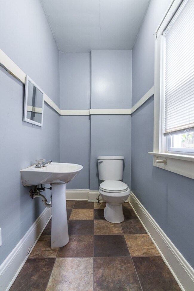 Building Photo - Charming 3BR Home with Classic Woodwork, Porch & Bonus Attic Space