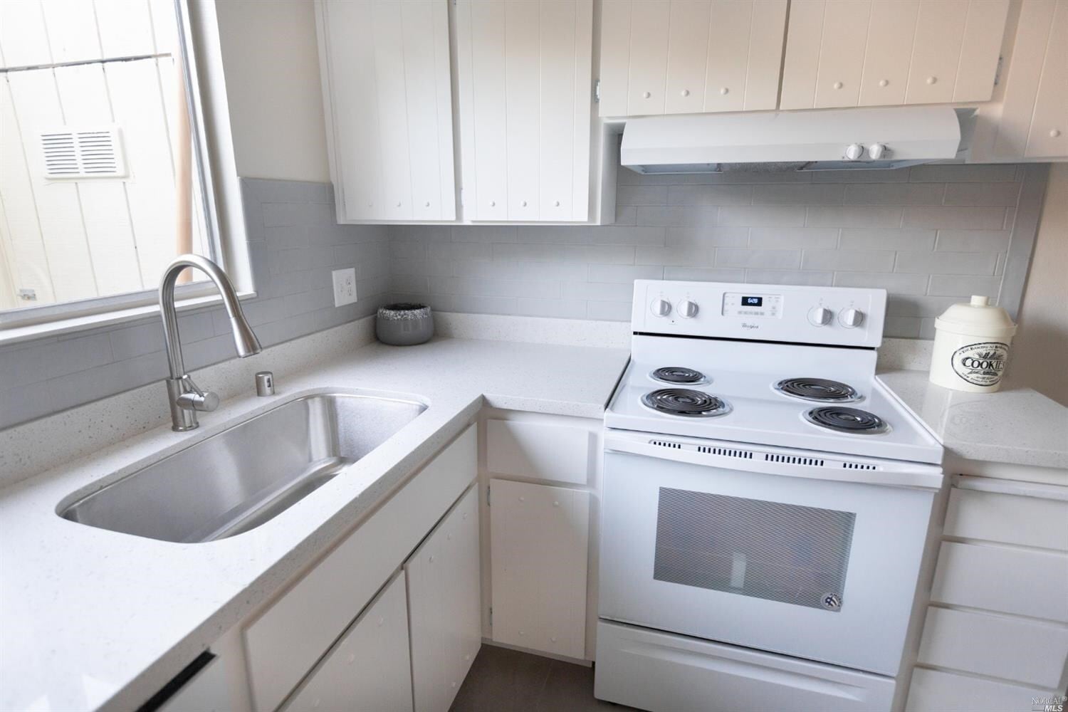 Bright white kitchen - 13B Oliva Dr