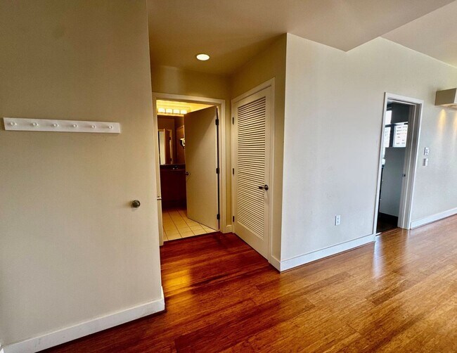 Building Photo - Corner Light. City Energy. Zero Compromise.