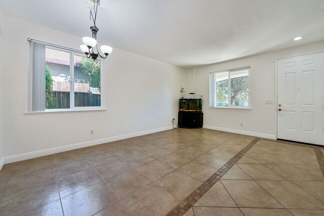 Building Photo - Spacious 4-Bedroom Home, Beautifully Maint...