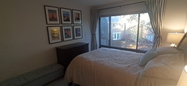 Second bedroom with floor to ceiling windows that boast quaint views - 100 Roberts Ln