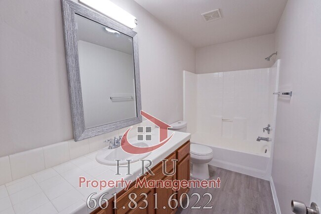 Building Photo - SW-Bakersfield  features 4 bed 2 bath with solar panels