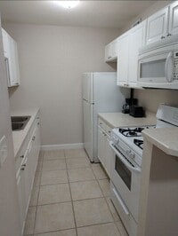 Building Photo - When Minutes Matter, Live Where You Work and Play @ Summit House Condominiums!