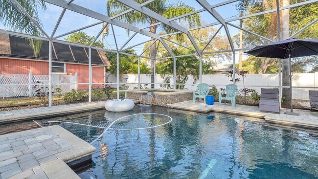 Building Photo - Luxurious FURNISHED 4BR/3BA Pool Home with...