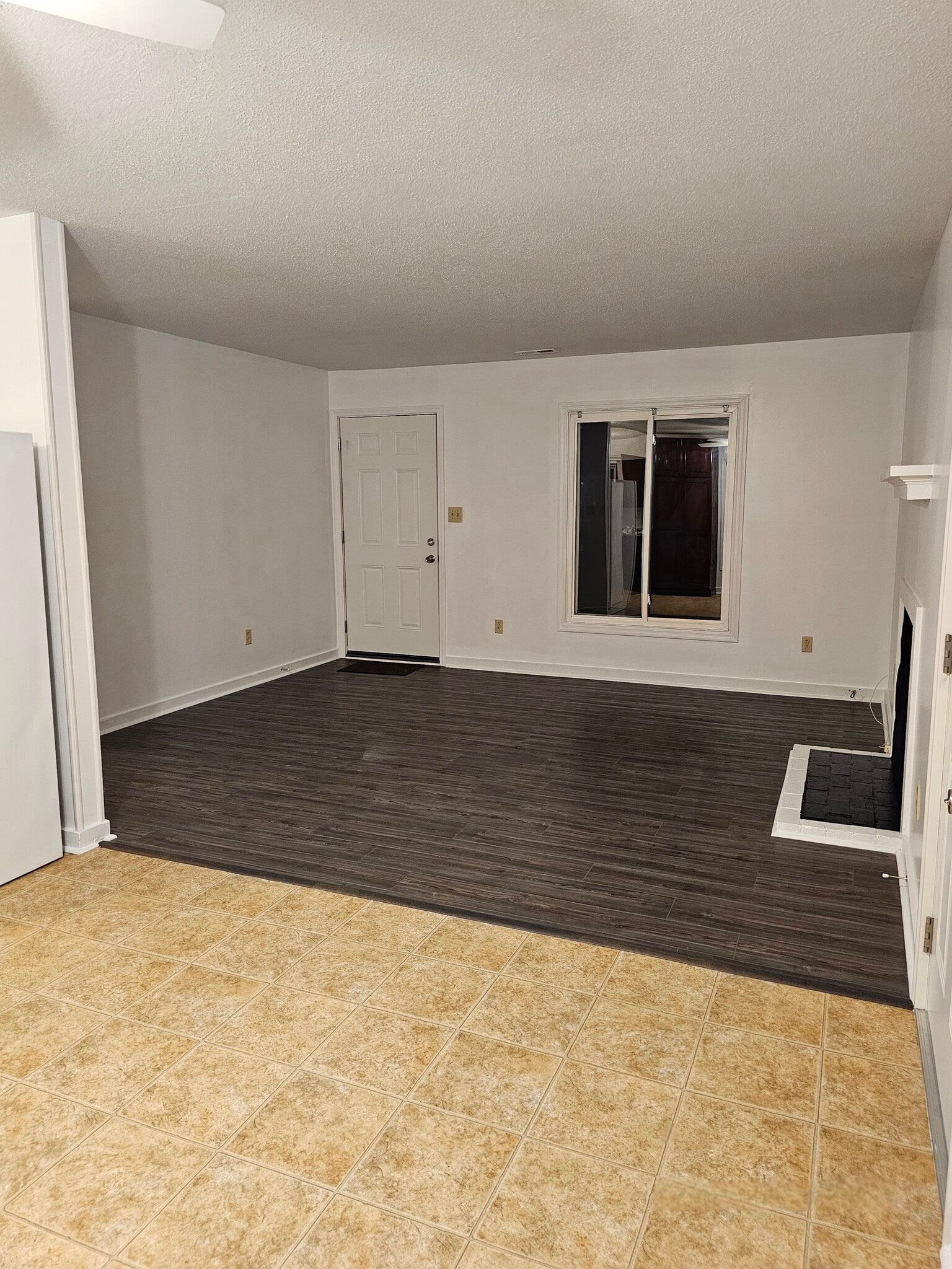 Living room with decorative fireplace, could be converted. - 404 Rams Rd