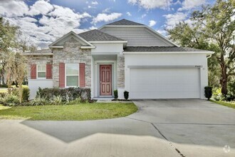 Building Photo - Lovely 3/2 Spacious Home with a Fenced Bac...