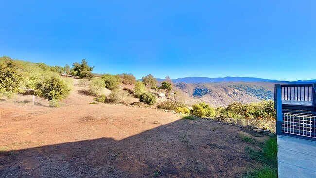 Building Photo - Spacious Two-Story Country Home with Amazing Views Looking out, and Privately Fenced and Gated Ya...