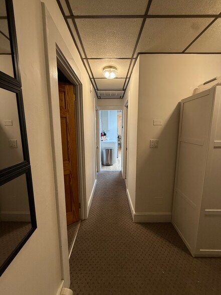 Hall looking towards kitchen. Getting new floors, ceiling, lighting and walls. - 9 Green St