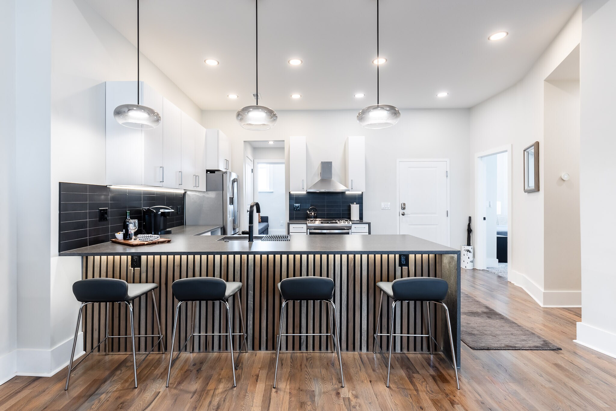 Kitchen opens to bedrooms 2 and 3, laundry. - 795 E McMillan St