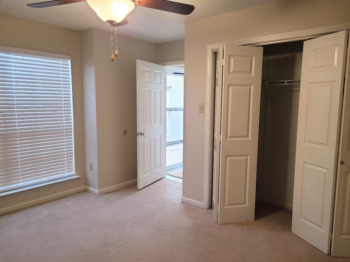 Guest bedroom #2 with window overlooking private patio - 12439 Coursey Blvd