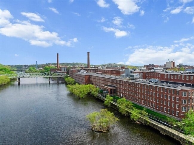 Building Photo - Stylish Industrial Loft with Exposed Brick, High Ceilings & Modern Kitchen