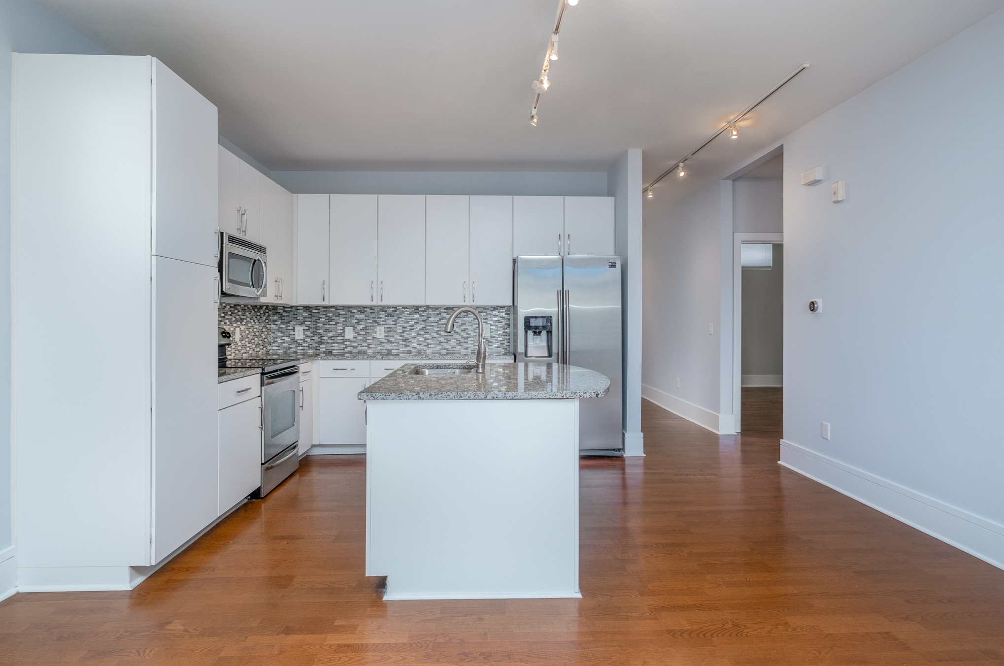 Kitchen and dining area, with a look at the 2nd bedroom entrance on the right - 1600 Fulton Ave