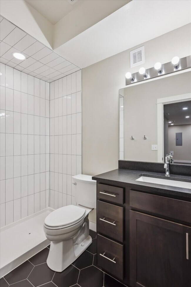 Building Photo - Modern 4-Bedroom Townhome with Rooftop Deck Near Sloan’s Lake & Light Rail
