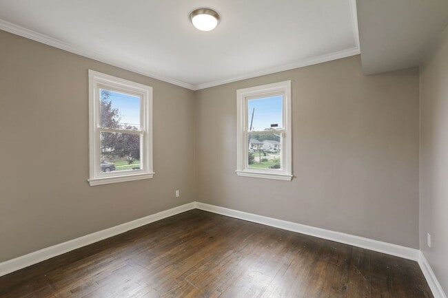 Building Photo - Move-In Ready Cape Cod with 3 Finished Levels & Huge Backyard
