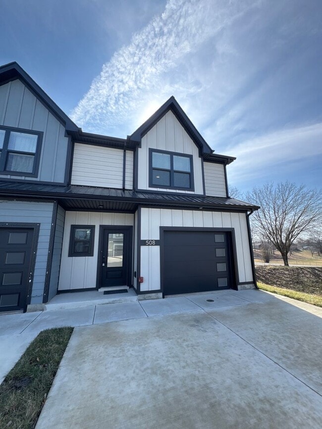 Building Photo - “Stylish 3BR End-Unit | Open Concept | Quartz Kitchen | Garage + Deck