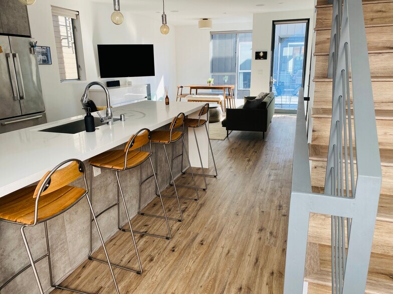 2nd Floor Kitchen Islan (note: Full Motion Smart Flat Screen TV so you can watch while eating at the - 7197 Formosa Fusion Ct
