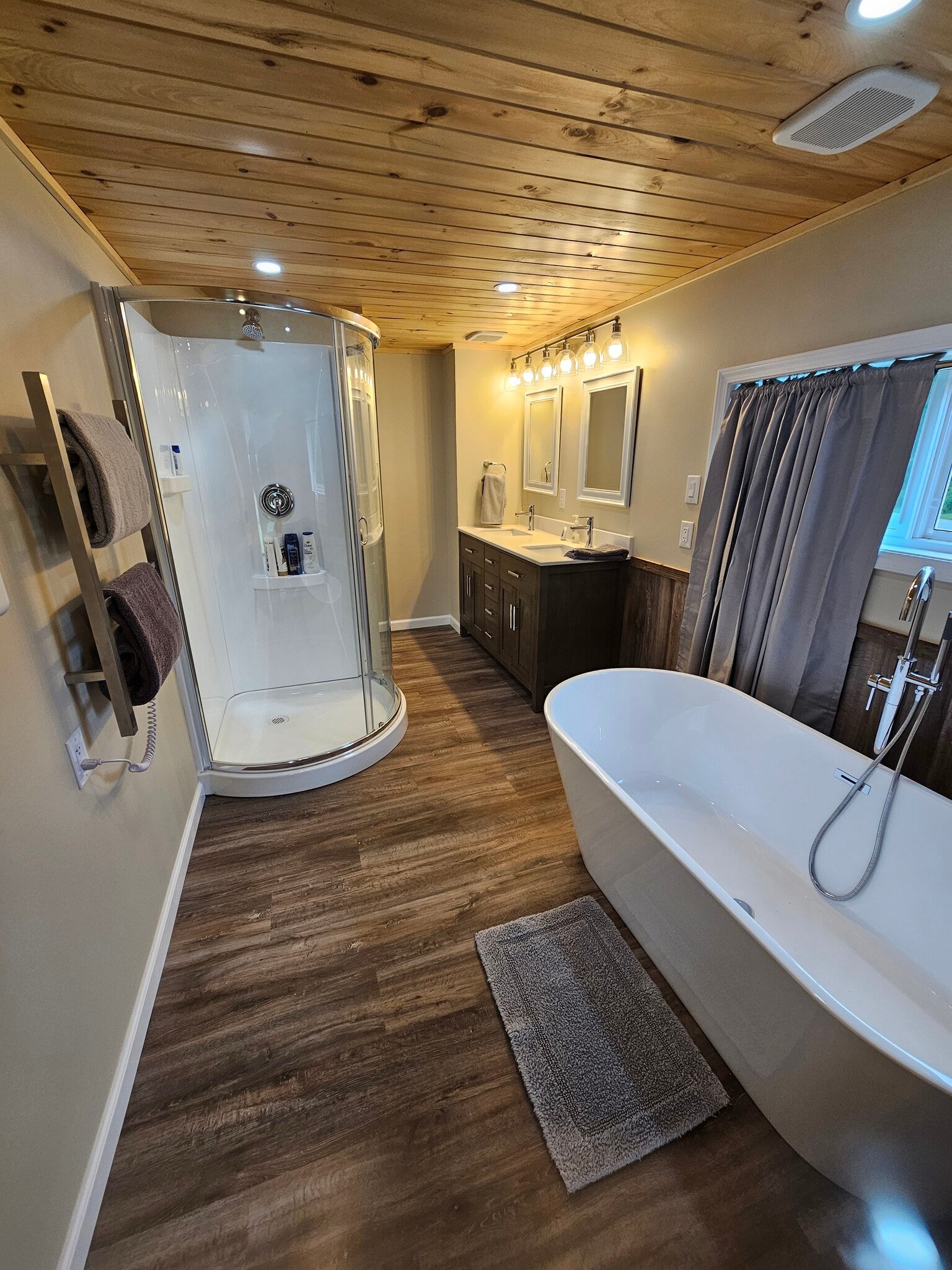 View upon entry to Primary Bath with Separate Shower, Towel Heater, Double Vanity, & Soaking Tub - 8152 Wilson Karr Rd